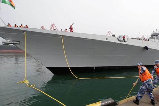 FILE PHOTO: Chinese navy personnel moor the Indian Navy warship INS Kolkata at Qingdao Port for the 70th anniversary celebrations of the founding of the Chinese People's Liberation Army Navy (PLAN), in Qingdao, China, April 21, 2019. REUTERS/Jason Lee/File Photo
