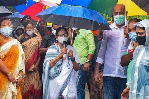 Mamata Banerjee on Tuesday also distributed relief materials among locals in Medinipur and instructed the administration to ramp up countermeasures. File pic/PTI