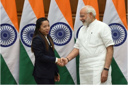 Prime Minister Narendra Modi with Olympics Silver-medalist Mirabai Chanu in this file pic. (Image: Twitter/Narendra Modi)
