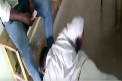 In a video which went viral on social media, Muthusamy can be purportedly seen in tears and falling at the feet of Gopinathan. (Image: Screengrab from video shared on Twitter by @KM_TheHindu)