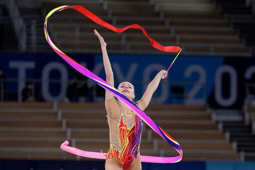 Anastasiia Salos, of Belarus, performs during the rhythmic gymnastics individual all-around final at the 2020 Summer Olympics, Saturday, Aug. 7, 2021, in Tokyo, Japan. (AP Photo/Ashley Landis)