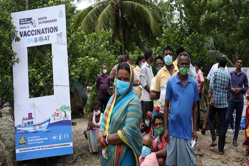Villagers wait to receive a dose of COVISHIELD vaccine, a coronavirus disease (COVID-19) vaccine manufactured by Serum Institute of India, during "Vaccination on boat" programme in Gosaba Island in the eastern state of West Bengal, India. (Reuters)