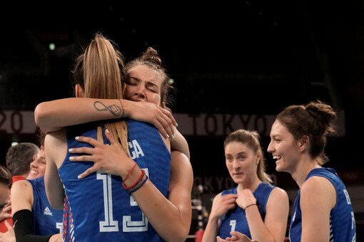 Players from Serbia celebrate after defeating Korea (AP)