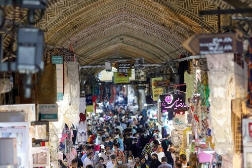Iranians walk through Tehran Bazaar as coronavirus disease (COVID-19) cases spike, in Tehran, Iran, July 28, 2021. (Image: via Reuters)