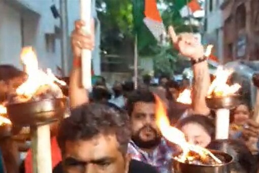 BJP members take out torch rally. (Image: Twitter/ @BJP4Bengal)