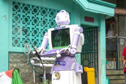 The robot's head is made from a rice cooker, and it is operated by remote control with a 12-hour battery life- Reuters 