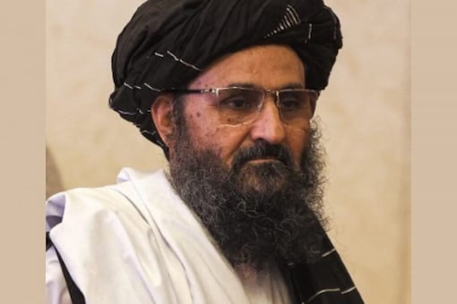 In this file photo taken on July 18, 2021, the leader of the Taliban negotiating team Mullah Abdul Ghani Baradar walks after the final declaration of the peace talks between the Afghan government and the Taliban in Qatar's capital Doha. (AFP)