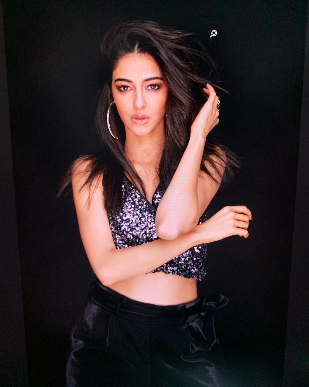 Ananya Panday goes glam in the shimmer top and velvet pants.
