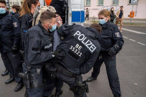 Police Protesters Clash As Thousands March Against Covid Curbs In Berlin