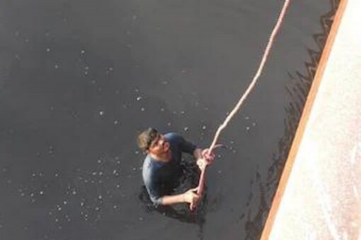 The man claimed to the police that he spent the night holding on to a pillar of the bridge.