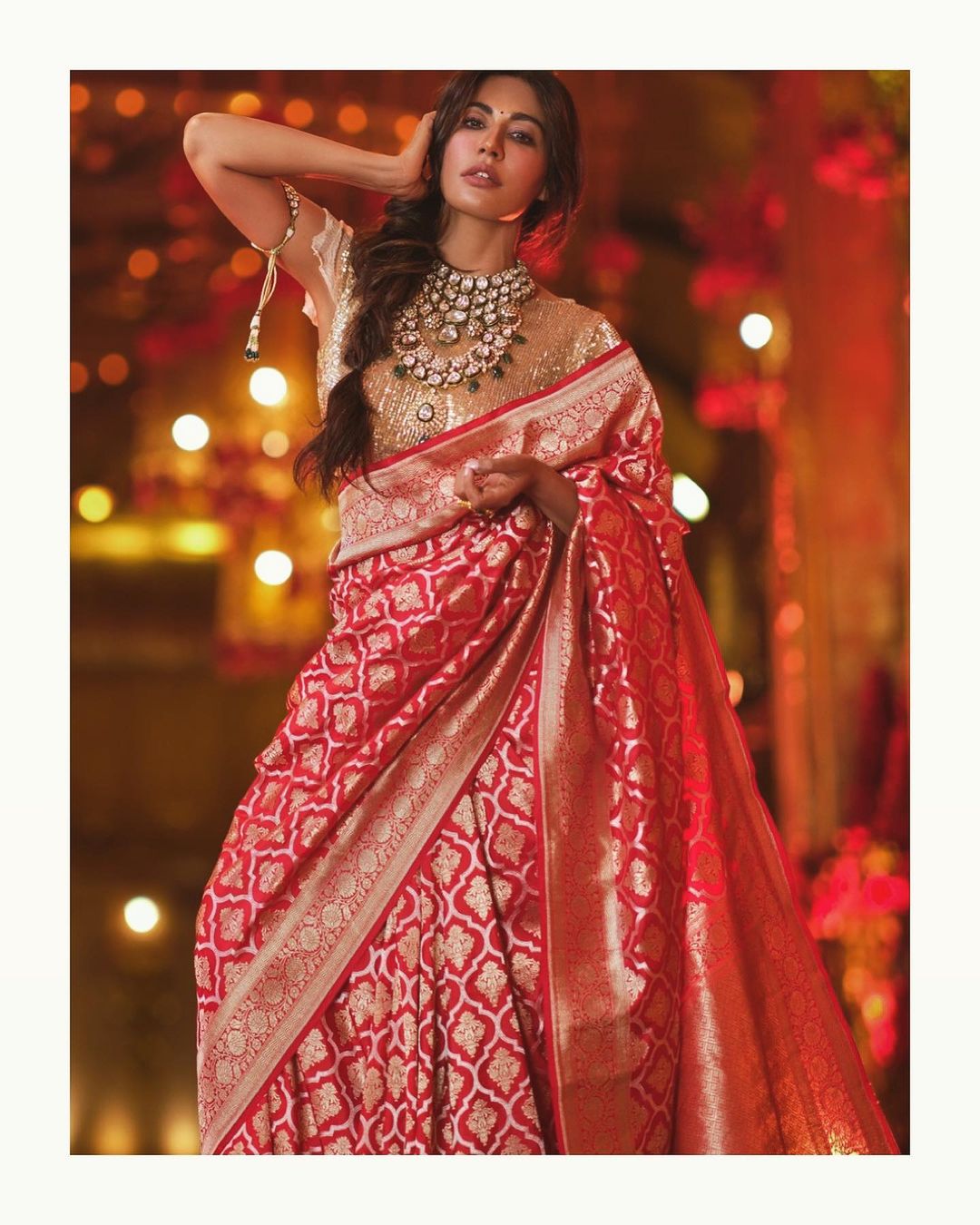 Chitrangda Singh strikes a pose in the red saree. 