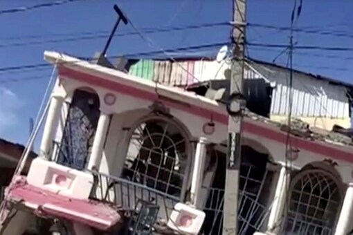 A view of a collapsed building following an earthquake, in Les Cayes, Haiti, in this still image taken from a video obtained by Reuters on August 14, 2021.  REUTERS TV via REUTERS THIS IMAGE HAS BEEN SUPPLIED BY A THIRD PARTY.