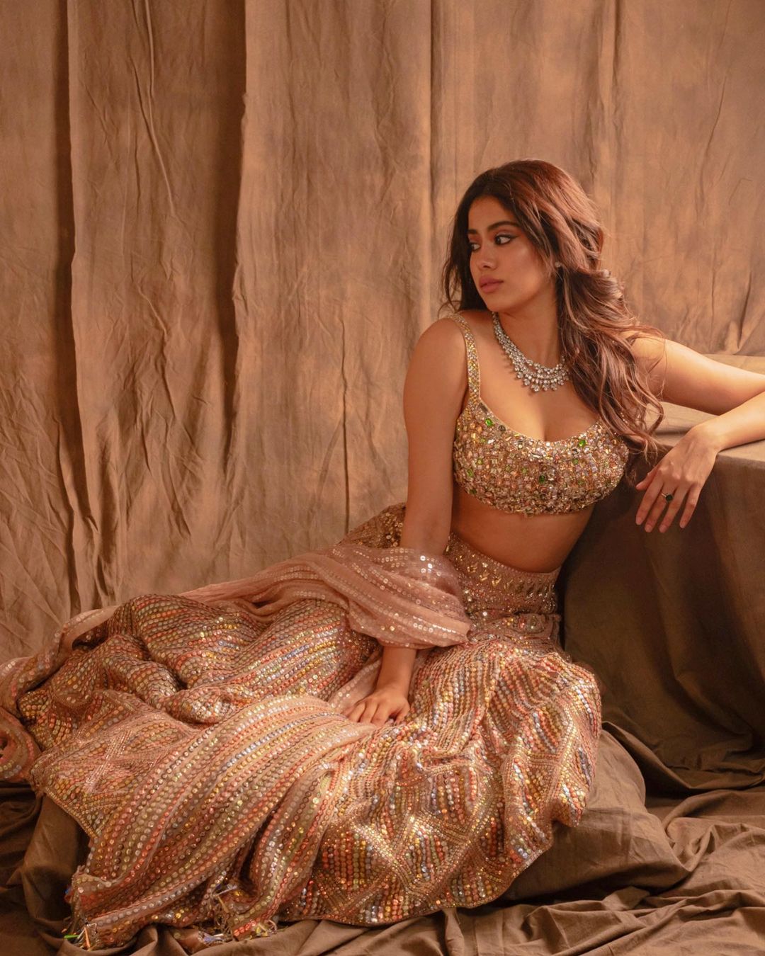 Janhvi Kapoor is looking like a princess in the sequinned lehenga. 