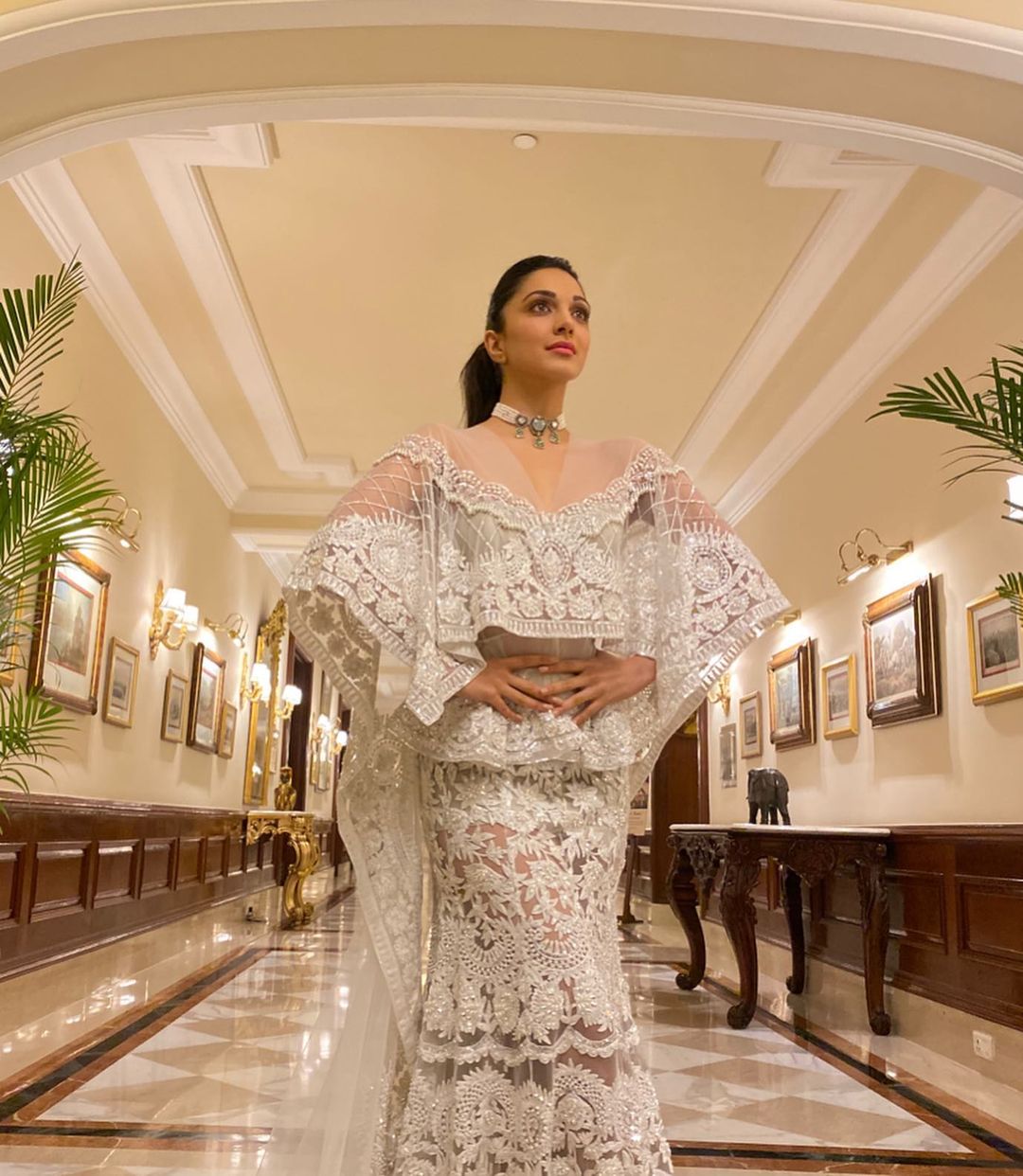 Kiara Advani looks stunning in the white embroidered ensemble.