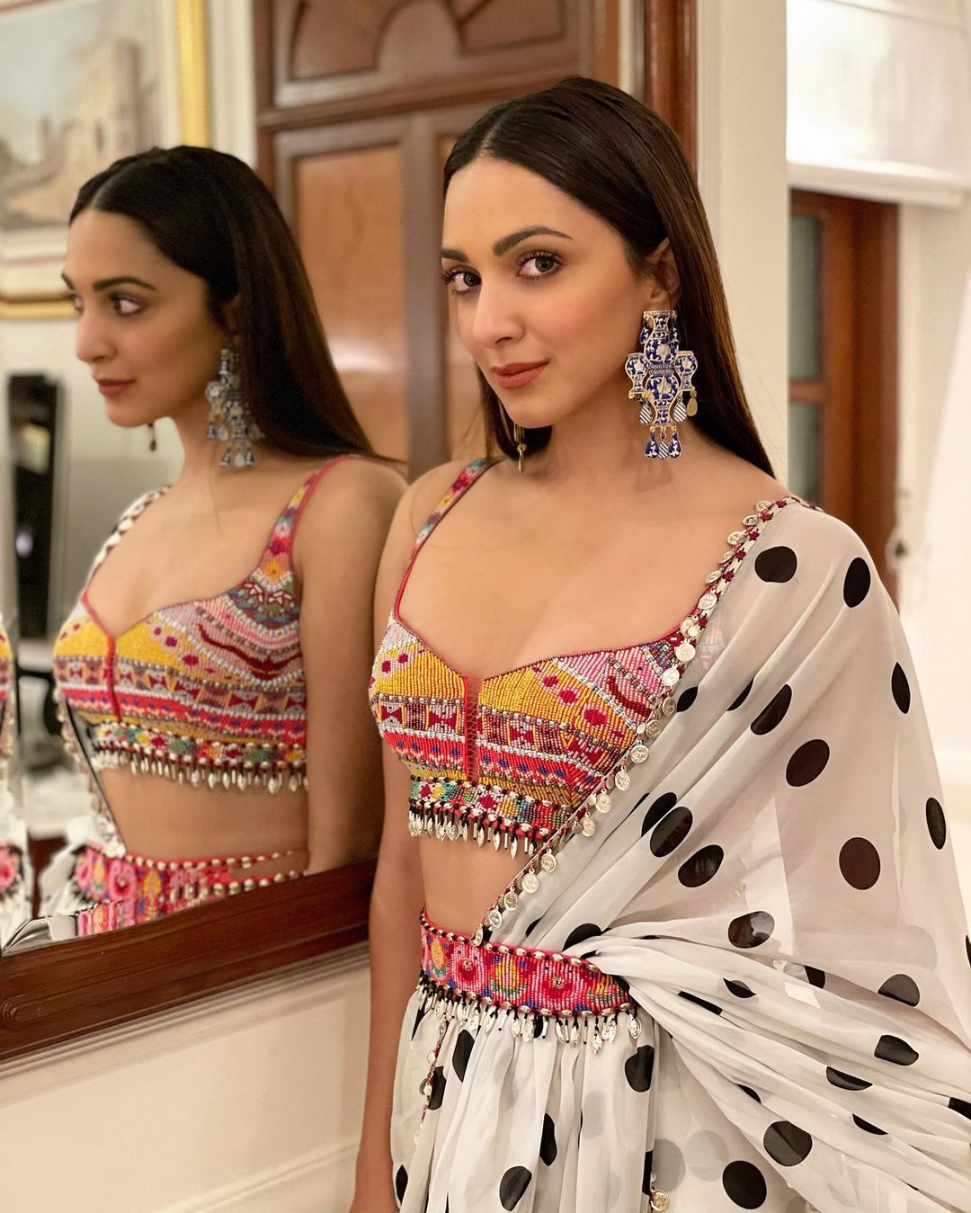 Kiara Advani pairs her polka dotted saree with beaded blouse.