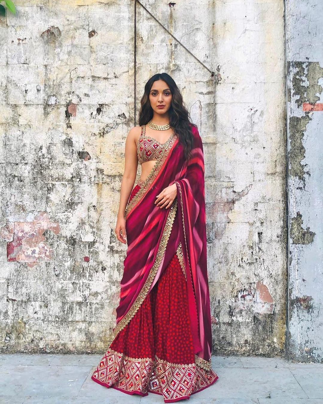 Kiara Advani looks beautiful in the maroon lehenga.