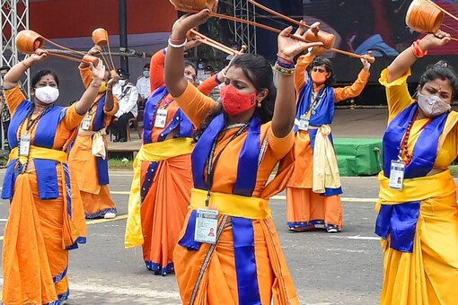 Folk artists perform during a full dress rehearsal for the 75th Independence Day celebrations at Red Road, Kolkata, Friday, August 13, 2021.  (PTI)