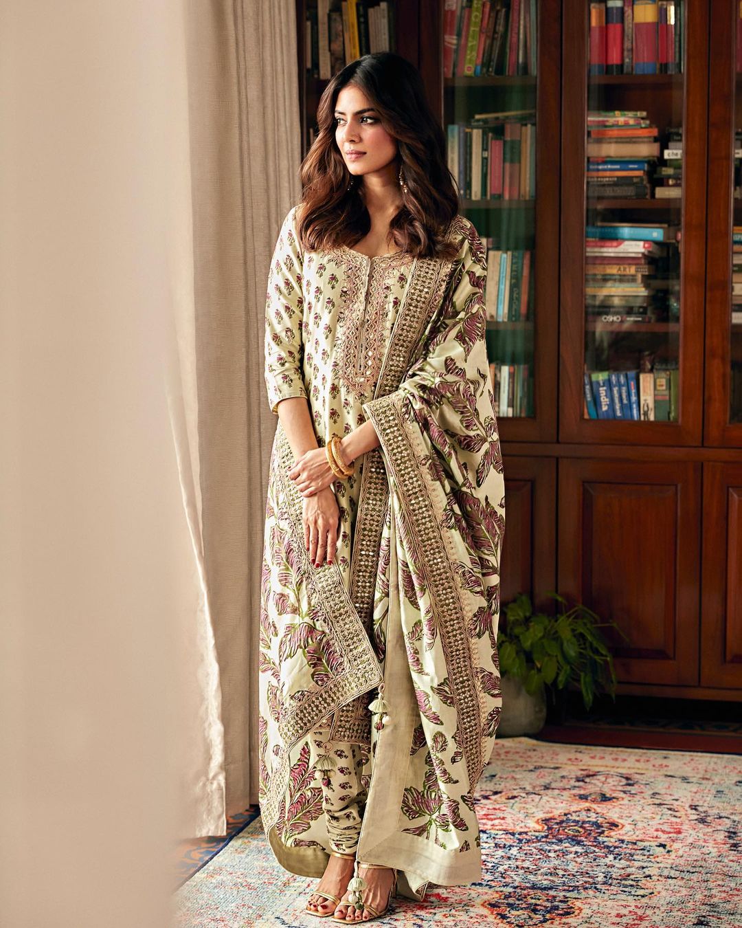Malavika Mohanan cuts a statusque figure in the floral suit.