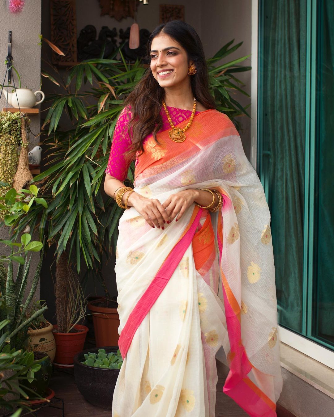 Malavika Mohanan looks graceful in the white saree.