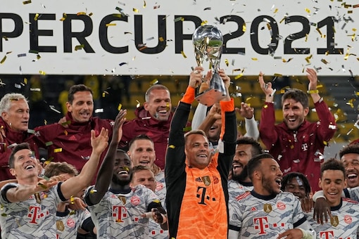 Manuel Neuer lifts the German Supercup trophy (AP)