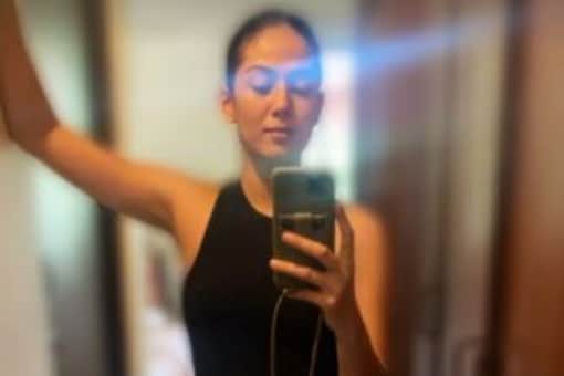 Mira Kapoor shared a mirror selfie on Instagram stories, in which she can be seen smiling for the camera in a black tank top and checkered maternity palazzo.