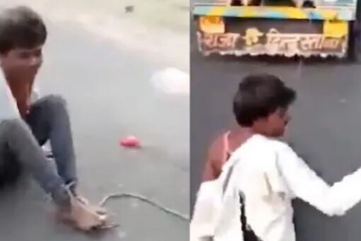 A tribal man died in Madhya Pradesh’s Neemuch district after he was beaten, tied to a vehicle and dragged by a group of people on the road on suspicion of theft. (Image: News18)