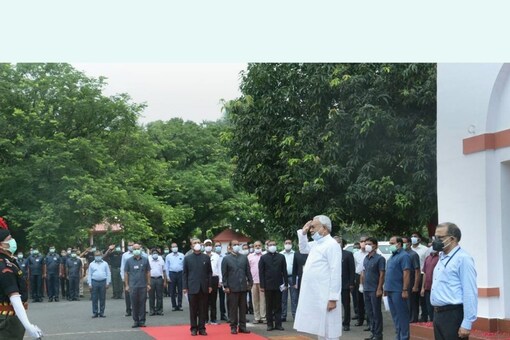 Patna: Bihar Chief Minister Nitish Kumar salutes after hoisting the Tricolour during the 75th Independence Day function at his official residence, in Patna, Sunday, Aug 15, 2021. (PTI Photo) 