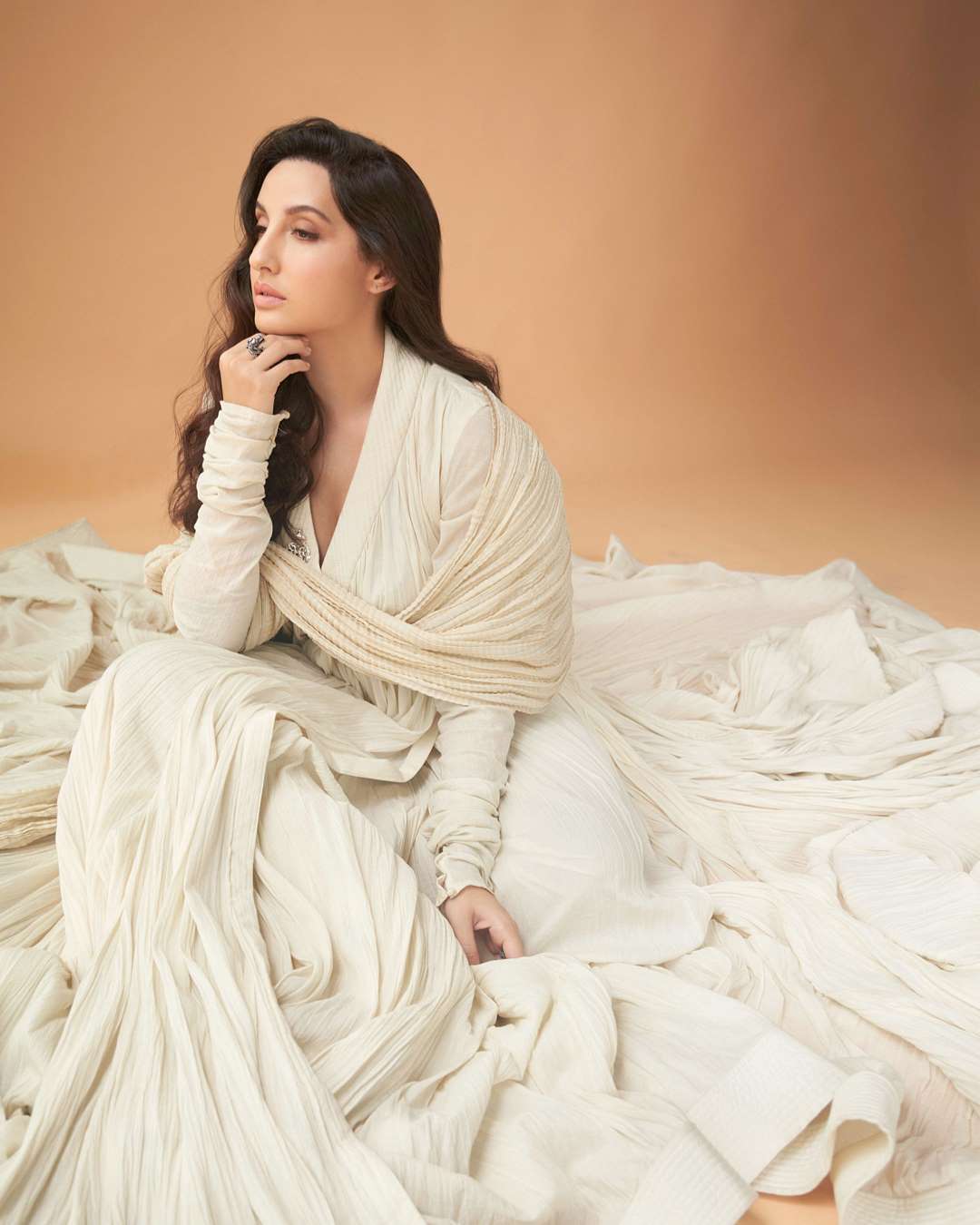 Nora Fatehi looks gorgeous in the ivory suit.