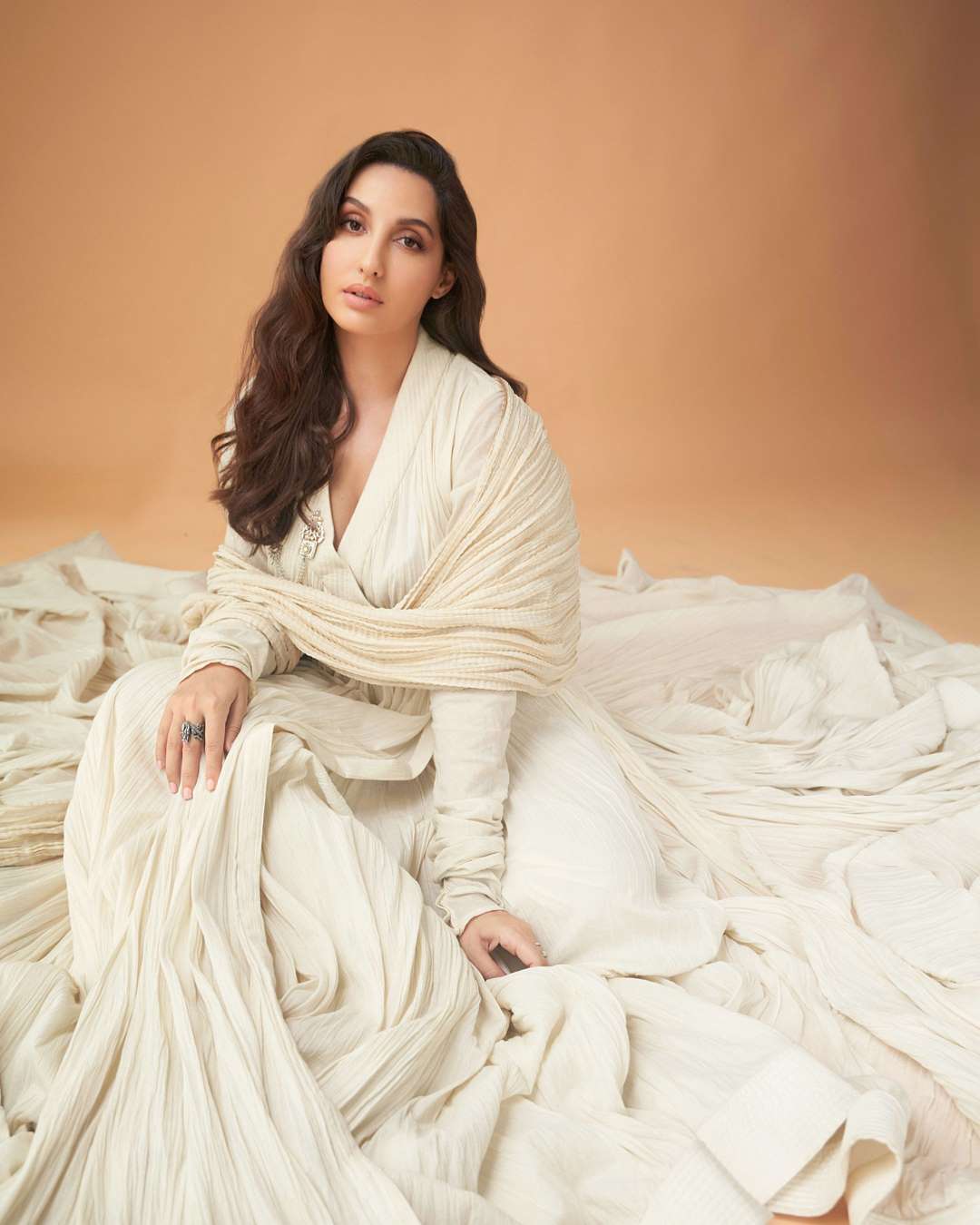 Nora Fatehi is exuding grace and poise in the off-white suit.