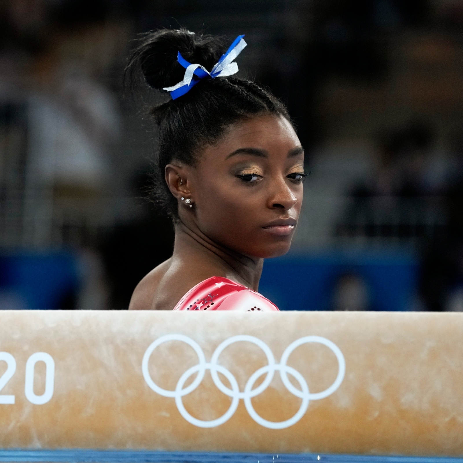 Simone Biles, of the United States, prepares to start her performance on the balance beam during the artistic gymnastics women's apparatus final at the 2020 Summer Olympics, Tuesday, Aug. 3, 2021, in Tokyo, Japan. (AP Photo/Gregory Bull)