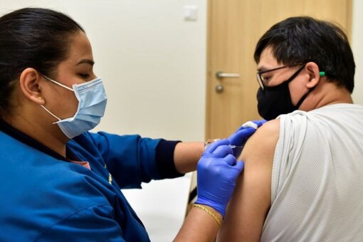 A nurse at StarMed Specialist Centre, administers the Sinovac vaccine to in Singapore (REUTERS)