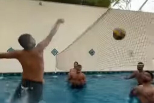 MI cricketers enjoy the game of pool volleyball.  (screen grab)