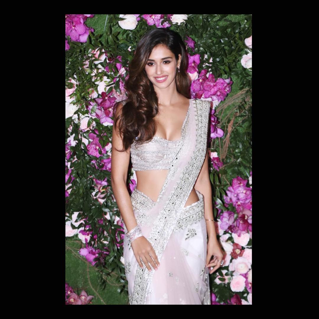 Disha Patani looks sensuous in the white saree.