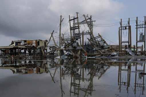 For File: Damaged power lines and homes can be seen days after hurricane Ida ripped through Grand Isle, Louisiana, U.S., September 2, 2021. (Credits: REUTERS)