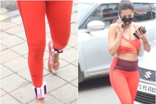 Malaika Arora is seen in a red sports bra and matching leggings during a recent outing.