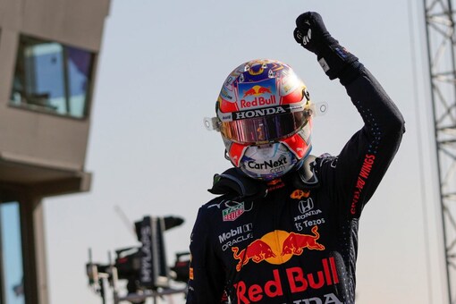 Red Bull driver Max Verstappen celebrates clinching the pole position (AP)