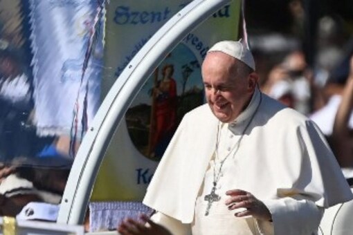 Pope Francis takes a tour in an open vehicle to greet faithful before a Holy Mass at the end of an International Eucharistic Congress in Budapest on Saturday, during his papal visit to Hungary. (Image: Attila KISBENEDEK/AFP) 