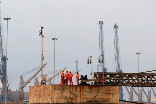 Workers wait for a cargo ship to beach at Mundra Port in Gujarat. (Reuters)