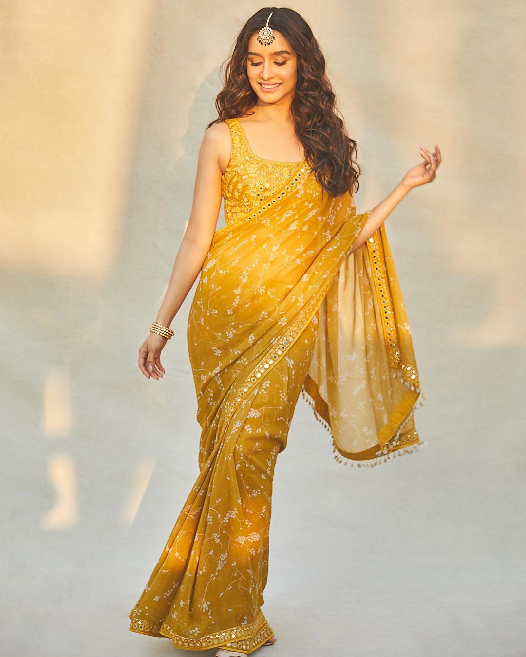 Shraddha Kapoor looks beautiful in the mustard yellow saree.