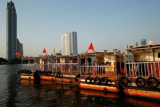 FILE PHOTO: Boats that are used to transport tourists around the Chao Phraya river are seen idle due to travel bans and border closures from the global coronavirus disease (COVID-19) outbreak in downtown Bangkok, Thailand February 4, 2021. Picture taken February 4, 2021. REUTERS/Jorge Silva