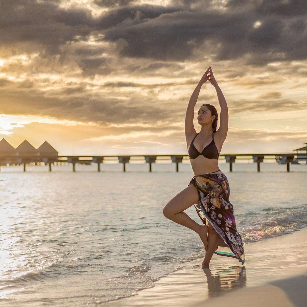 Tridha Choudhury strikes a pose in her black bikini and sarong.