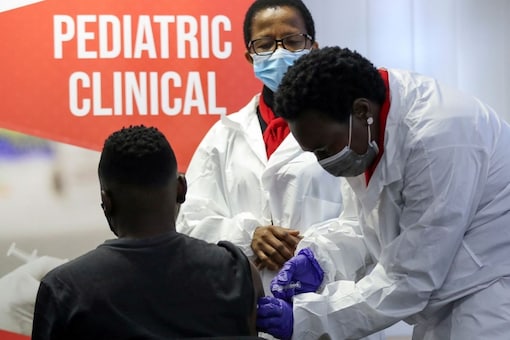 FILE PHOTO: A health worker administers a vaccine during the launch of the South African leg of a global Phase III trial of Sinovac's COVID-19 vaccination of children and adolescents, in Pretoria, South Africa, September 10, 2021. REUTERS/Siphiwe Sibeko/File Photo