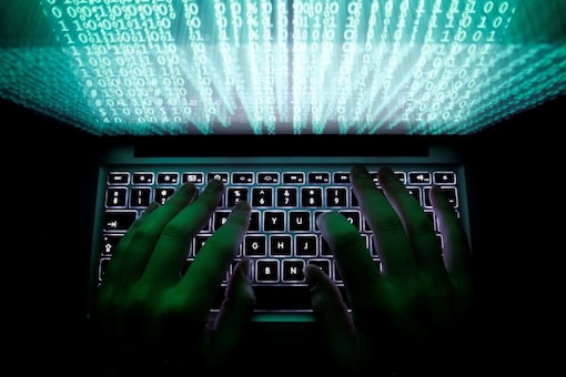 FILE PHOTO: A man types on a computer keyboard in this illustration picture. REUTERS/Kacper Pempel 