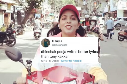 Riding a red scooter, Dhinchak Pooja can be seen looking straight at the camera and singing the song. (Image Credits: YouTube/Dinchak Pooja)