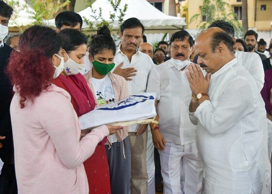 K'taka CM Basavaraj Bommai handed over the national flag, in which Appu was wrapped, to his family
