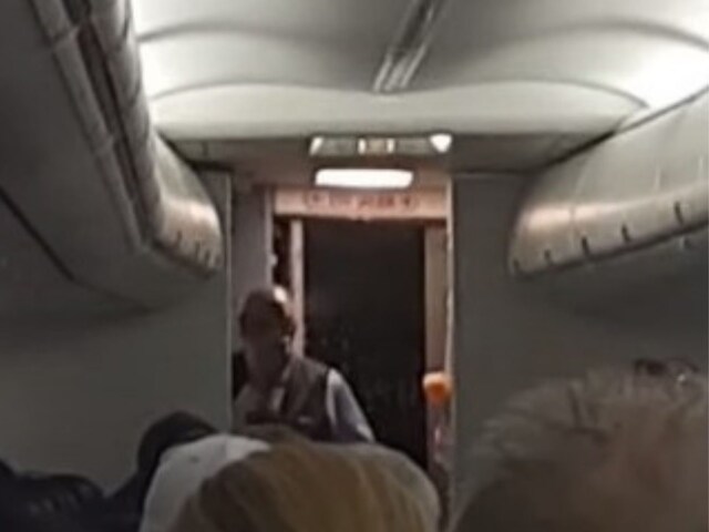 Flight Attendant Sings for Passengers as Takeoff Gets Delayed, Video ...