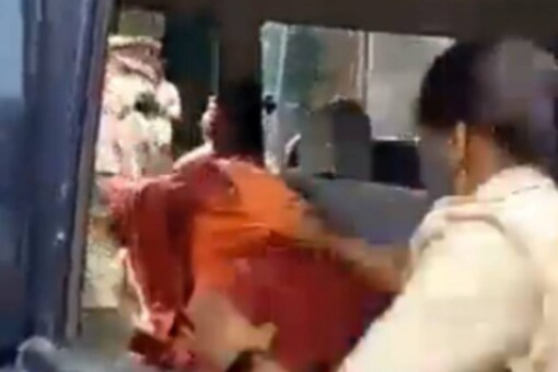 BJP MP going to Lakhimpur Kheri was violently showed inside a police vehicle. (Image: Screengrab from video/Twitter)