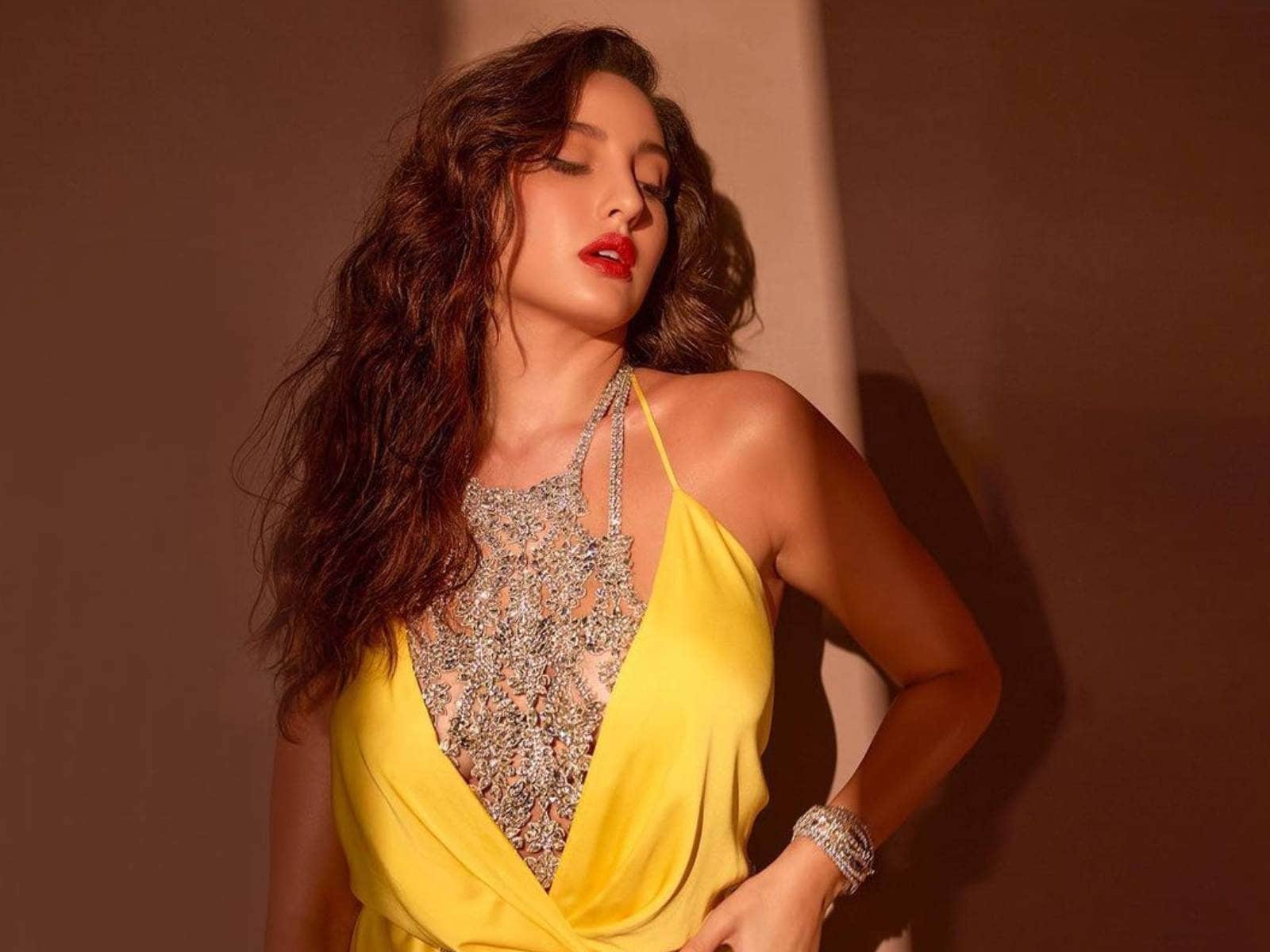 nora fatehi yellow saree