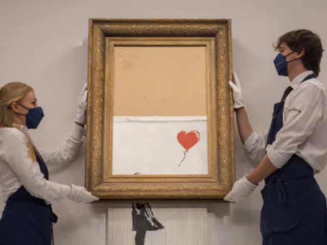 Partially shredded Banksy canvas works sold in London for 18.6 million euros ($25.4 million) (Credits: Reuters)