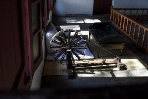 A wooden charkha (spinning wheel) used by Mahatma Gandhi is displayed at Sabarmati Ashram also known as Gandhi Ashram in Ahmedabad. (Image: AFP)